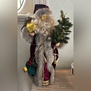 Festive Santa Claus Figurine with Gold and Green Accents